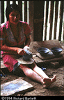Elsa coiling a mucawa from clay